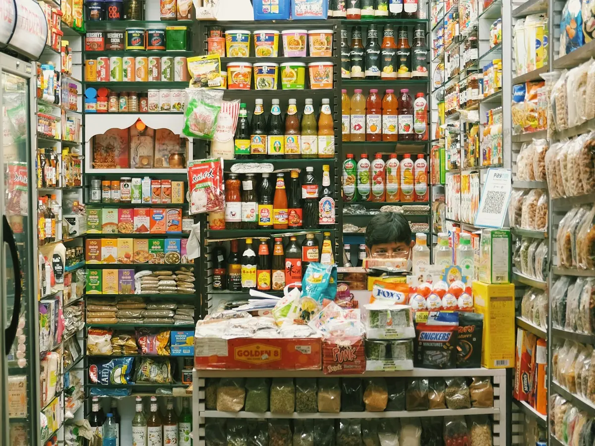 Shelves packed with groceries in a store.